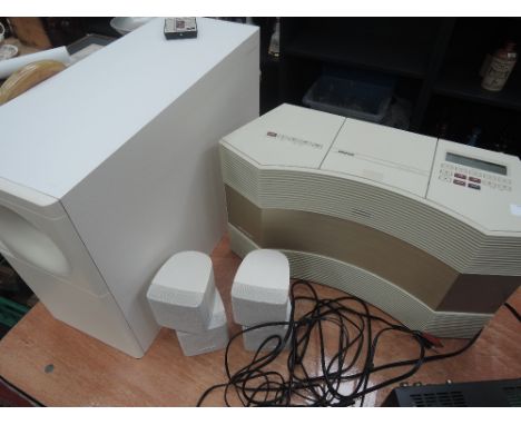A Bose Acoustic Wave CD3000 music system and Acoustimas 5 series 3 speaker system