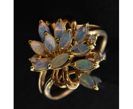 Opal cluster ring with three diamond accents, the yellow metal mount stamped '14K' and '585', size R½ approx, 5g gross approx