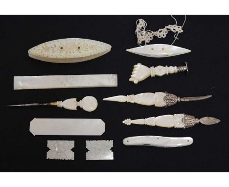 Quantity of mother-of-pearl items to include quill cutting tools, unengraved seal in the form of a fist, folding knife, flora