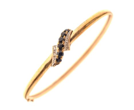 9ct gold, sapphire and diamond snap bangle, set six (of an original seven) sapphires between two pairs of graduated small dia