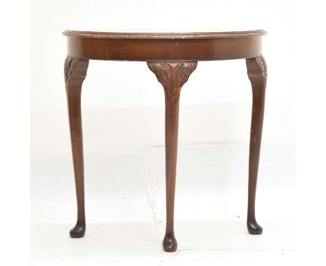 Mid 20th century walnut demi-lune console table with carved detailing and glass top, 74cm wide x 73cm high