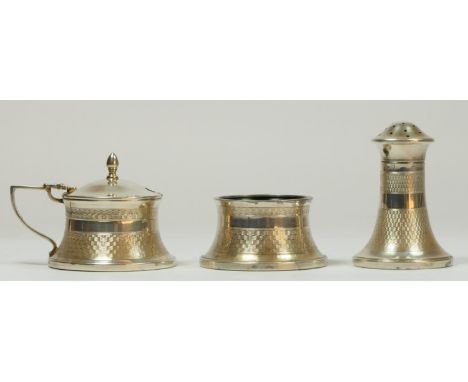 A silver three piece cruet set, Birmingham 1955, with engine turned decoration, Bakelite lined 