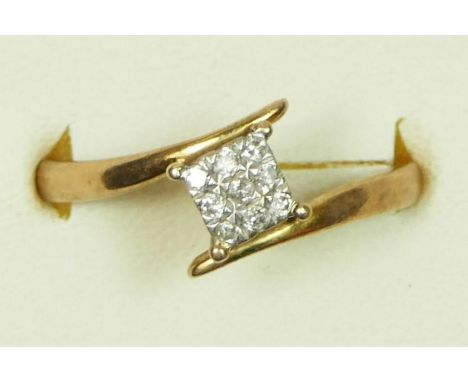 A 9ct gold and brilliant cut diamond panel ring, stated weight 0.10ct, n 1/2, 1.5gm 