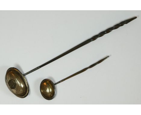 A George III silver toddy ladle, London 1790, with whalebone twist handle, 18cm and another unmarked example, inset with a 17