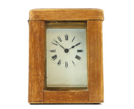 An early 20th Century 8 day carriage clock, brass cased, with bevel edged glass panels, complete with travelling case and key
