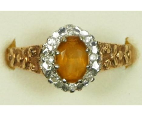 A vintage 9ct gold citrine and diamond cluster ring, London 1977 , textured shoulders, N, 3.4gmIn very good condition, with n