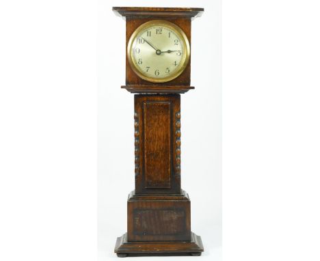 A miniature oak cased longcase clock, silvered dial, brass chapter ring with manual wind movement.40cm tall. 