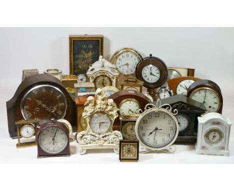 Four boxes of mantle clocks, having manual wind and quartz movements, to include an inlaid mahogany cased 8 day example. (4) 