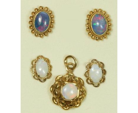 A 9ct gold mounted opal pendant and two pairs of 9ct gold mounted opal ear studs, 3.2gm. 