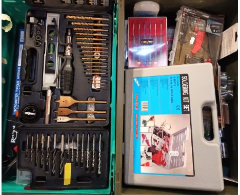 A collection of tools and accessories to include socket sets, Bosch drill set, soldering kit, comb jointer, clamps, multimete