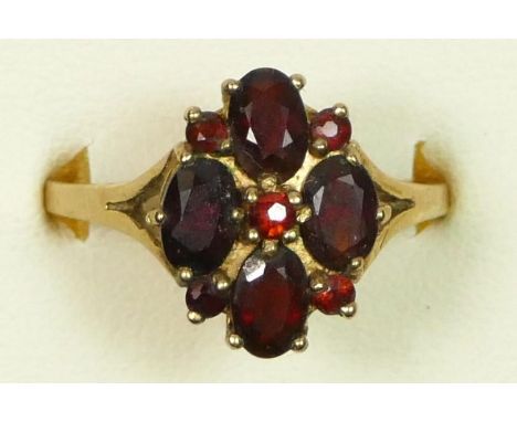 A 9ct gold and garnet cluster ring, R 1/2, 3.5gm 