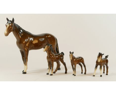 A collection of ceramics to include four Beswick horses, a four piece Beswick "cottage" tea and coffee service, two gobel fig