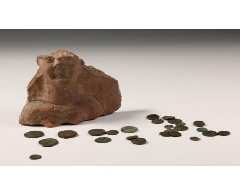   Lot of Greek and Roman antique coins. Herewith an earthenware antique fragment of a female bust, probably Roman, 2nd-3rd ce