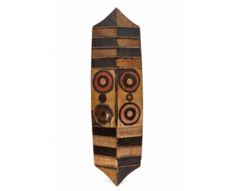   PNG, Ngaju Dayak, carved wooden warshield, ca. 1900, with geometrical painted patterns and circles. Collection of John Räde