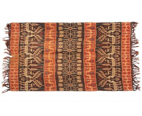   East Sumba, ikat hingi, with seven panels and a central habaku motive. Decorated with sea animals, birds and horses. Herewi