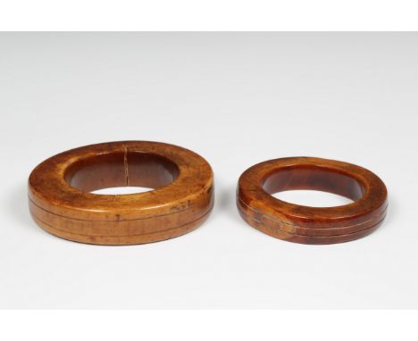   Eastern Flores, two ivory bracelets with dark patina, ca. 1900, traditionally worn by the young bride at the first visit of