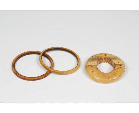  Eastern Adonara, Lambuga, kala bracelet for royalty, whale ivory, ca. 1920 and Eastern Timor, Mambai culture, two ivory bra