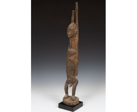   Mali, Dogon, wooden decorative sculpture with raised arms bought at Kalpa Art, 1984. Collection Otto Schaap. h. 84 cm. [1] 