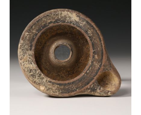   A Greek terracotta round oil lamp, 5th century BC and a Hellenistic oil lamp, 3rd-1st century BC with decor in relief. Prov