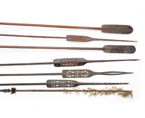   Papua, Asmat, three spears, two paddles and two spears, one with an unusual open carved arrow end h. 280 cm and smaller [7]