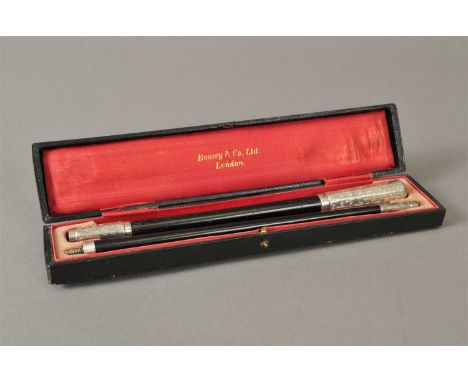 An early 20th century cased silver mounted conductors baton, V &amp; S, London 1928, the two part ebonised baton with engrave