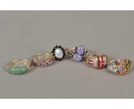 A silver purple jadeite ring, together with a silver stone set ring,a 9ct gold diamond and ruby ring, a 9ct gold opal and sap