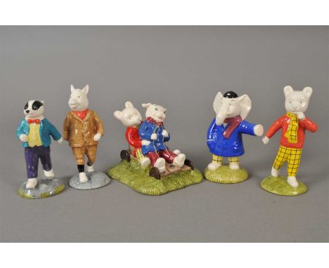 Five John Beswick Rupert the Bear figures comprising Rupert Bear and Algy Pup Go-Karting, Edward Trunk, Bill Badger, Rupert B