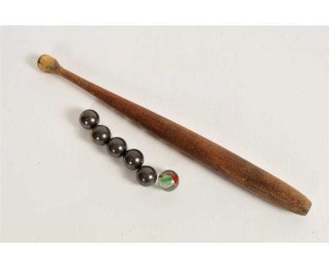 A 20th century bagatelle board together with pusher and associated balls.