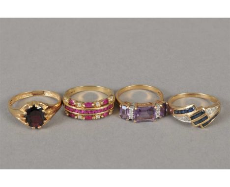 A 9ct gold ruby and diamond ring, together with a 9ct gold amethyst and diamond ring, a yellow metal sapphire and diamond rin