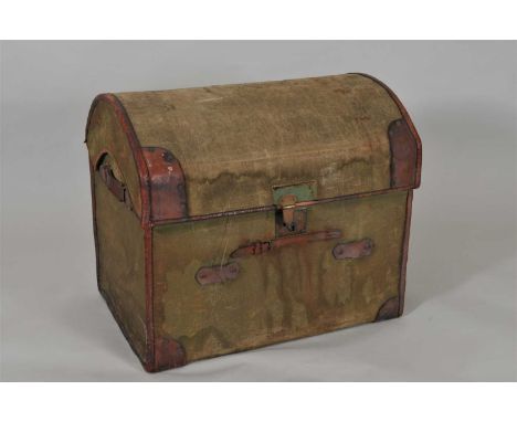 An Edwardian domed canvas covered travelling / storage trunk, with stitched leather borders and a central lock plate, the hin