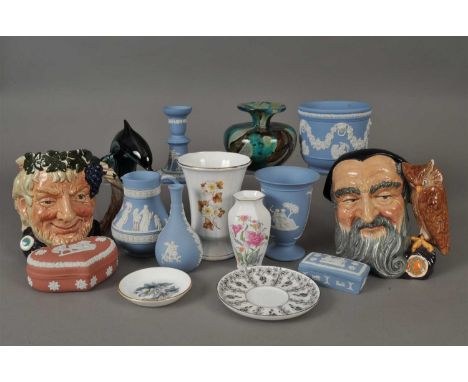 A small group of Wedgwood jasperware to include a blue candlestick, two vases, jug and trinket box together with a red jasper