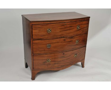 A late 19th / early 20th century mahogany bow fronted chest of drawers, the frieze inlaid with an ebony border, above three l