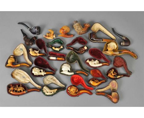 A collection of 19th century and later meerschaum and other tobacco pipes, to include novelty figural examples including an e