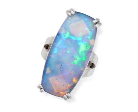 A FRENCH OPAL RING in 18ct white gold, set with a cabochon opal of 3.0cm, on a bifurcated band,&nbsp;French assay marks, size