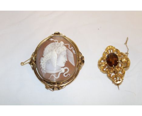 A Victorian pinchbeck oval brooch with good quality cameo female portrait and one other Victorian brooch set amethyst (2)