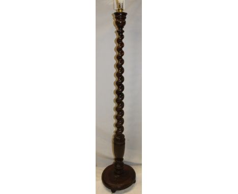 A 1930's/40's oak spiral twist standard lamp