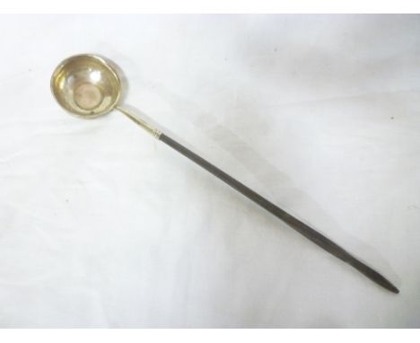 A 19th Century Continental silver toddy ladle with plain circular bowl and whale bone handle 