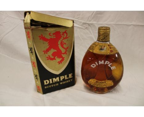 An old bottle of Dimple Scotch whiskey by Haig &amp; Co Limited in original box "By Appointment to Her Majesty the Queen"