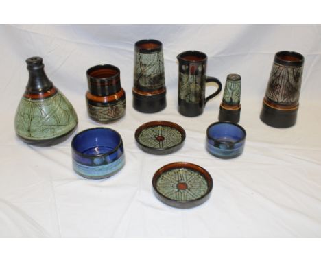 A selection of Cornish Celtic pottery including tapered table lamp, 8½" high, a pair of tapered vases, cylindrical jug, bowls