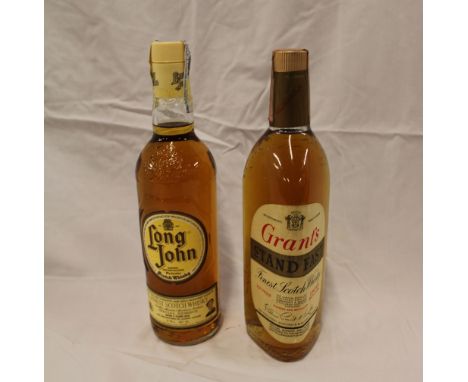 An old bottle of Grants "Stand Fast" Scotch whiskey and a bottle of Long John Scotch whiskey (2)
