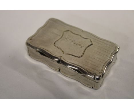 A Victorian silver rectangular snuff box with engraved hinged lid, Birmingham marks 1847, 3" long