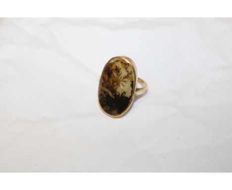 An 18ct gold dress ring set large moss agate panel