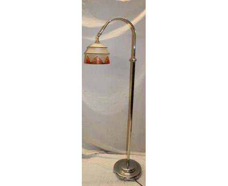 An Art Deco chromium plated adjustable rise-and-fall standard reading lamp with orange and yellow tinted opaque glass shade