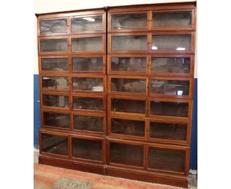 A pair of good quality Globe-Wernicke-style seven-tier mahogany stacking library bookcases, each section with double opening 