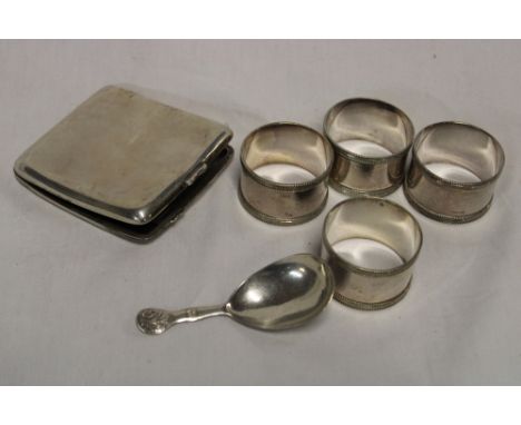 A silver rectangular silver concave cigarette case, a Victorian silver caddy spoon with raised leaf decoration, Exeter marks 