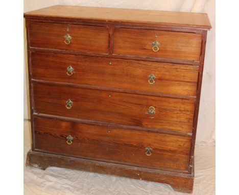 A 19th century pitch pine chest of two short and three long drawers with brass ring handles on plinth base, 42" long x 40" hi