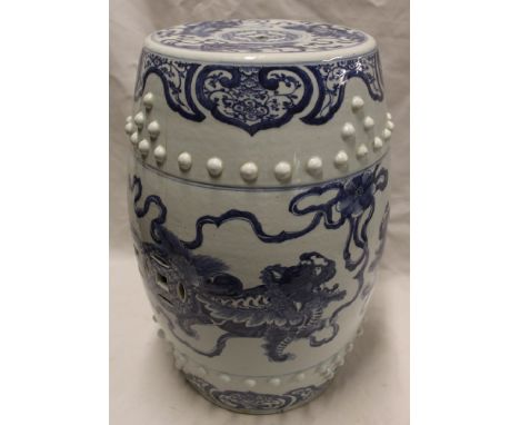A 19th century Chinese pottery barrel-shaped seat with blue and white dragon and floral decoration, 20" high (slight damage)