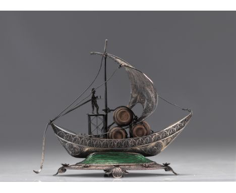 Sculpture in silver filigree and enamel "the boat" and hallmarked. This sculpture shows a boat and a figure on board, with th