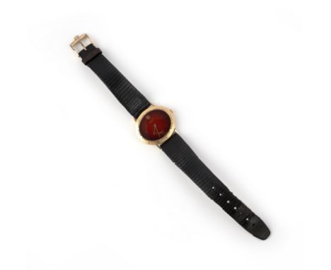 Rolex, a gold Cellini wristwatch, the oval red enamelled dial with gold hands, within a gold bezel with incised baton indicat