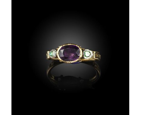 A Georgian amethyst and diamond mourning ring, circa 1785, set with an oval amethyst within a closed-back setting, between ro